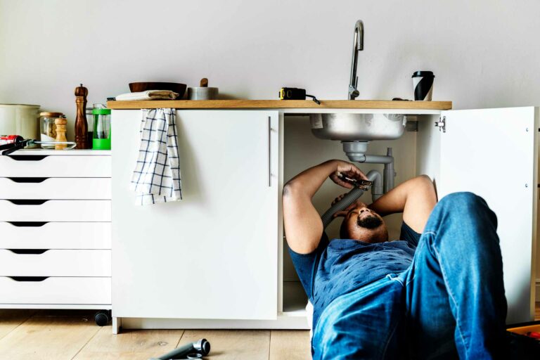 plumber-man-fixing-kitchen-sink